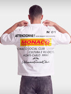 Monaco Trackside white boxy tee worn by model, back view with red and yellow MONACO racing print.