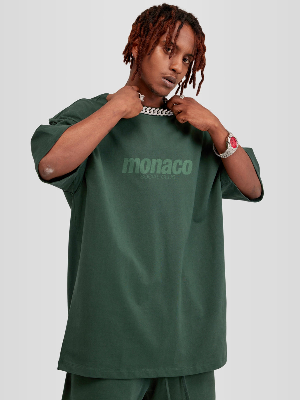 Man model wearing the Tonal Heavyweight Tee in Forest Green with tone-on-tone Monaco Social Club chest print — Monaco Social Club streetwear