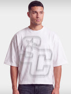 Monaco Club white boxy tee worn by model, front view with tonal grey SC monogram and star.