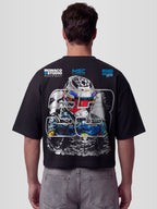 Model wearing the #33 Racing Series Heavyweight Boxy Tee in Black with full-color sketched racing driver portrait and MSC Championship badges — Monaco Social Club streetwear