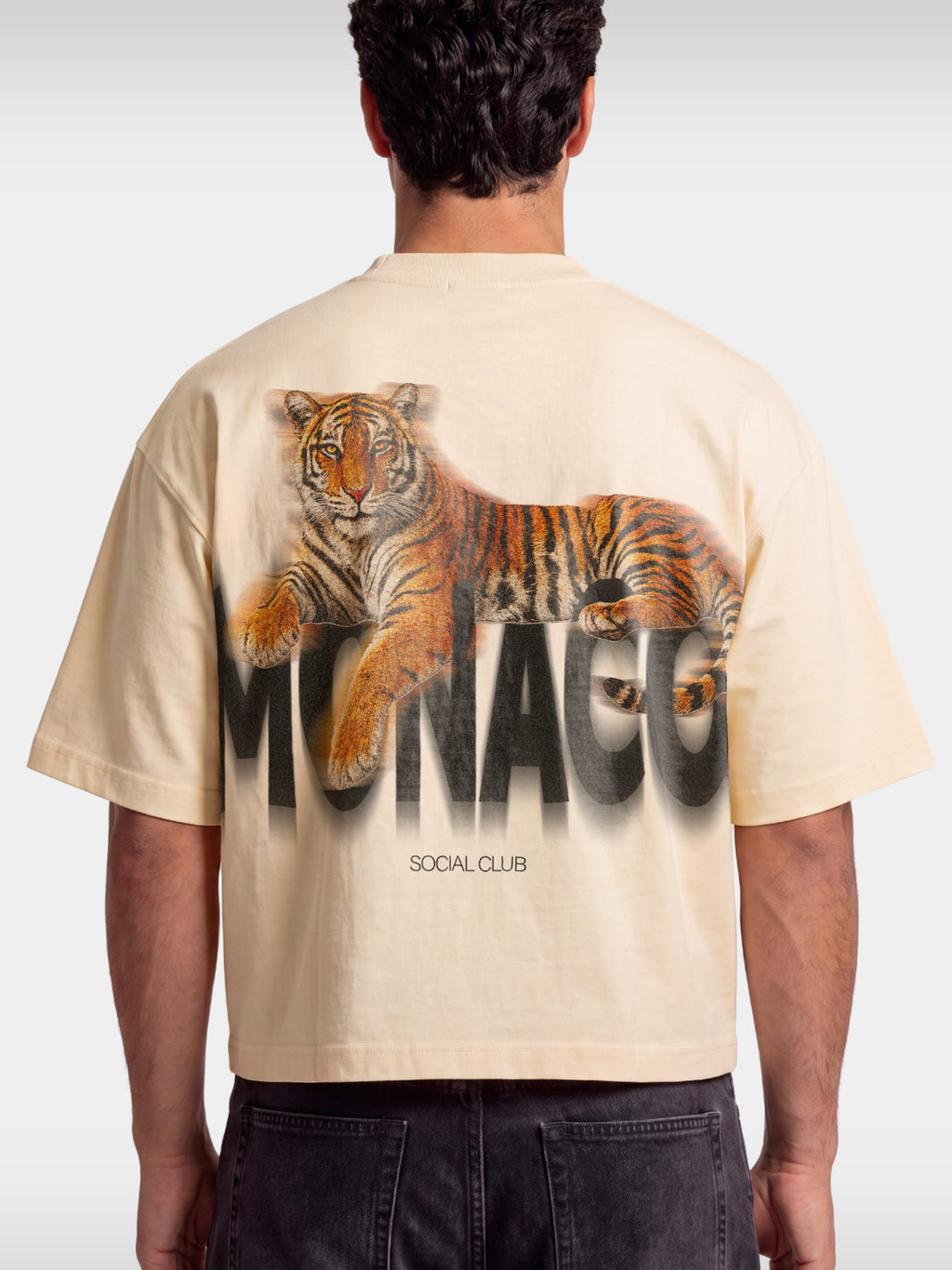 Monaco Tiger ivory boxy tee worn by model, back view with photoreal tiger and Social Club text.