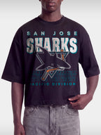 Black Sharks vintage boxy tee on model, front view with San Jose shark logo and teal lettering.