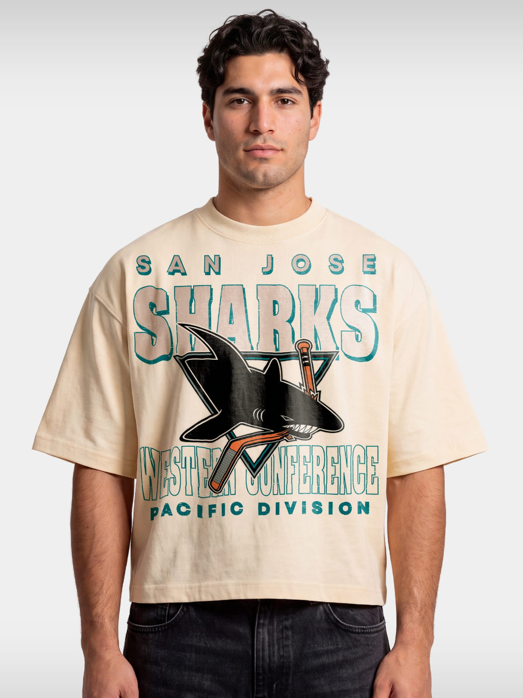 Monaco ivory San Jose Sharks boxy tee worn by model, front view with distressed shark graphic.