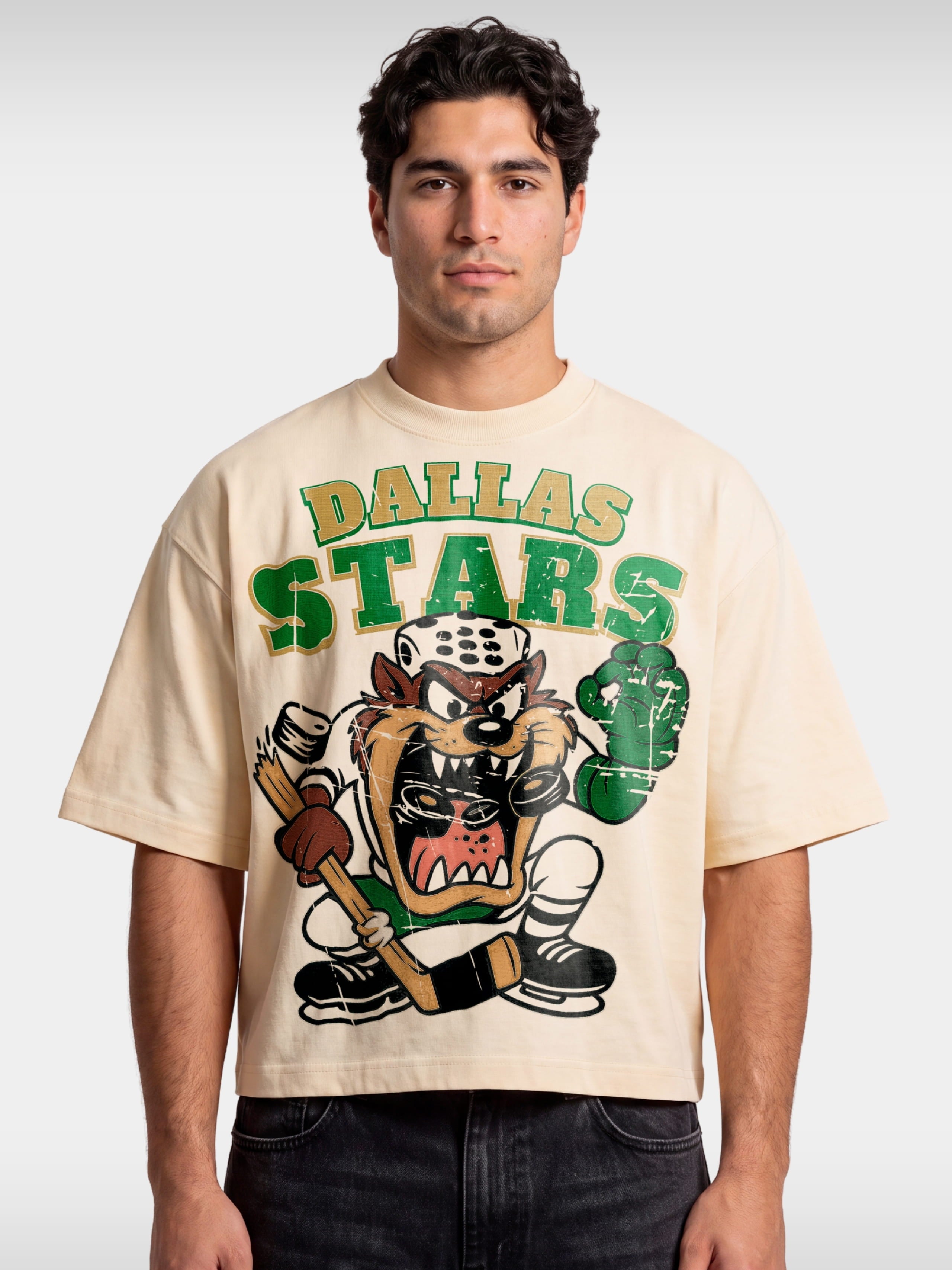 Ivory Taz Dallas Stars boxy tee worn by model, front view with retro cartoon hockey graphic.