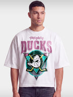White Mighty Ducks boxy tee worn by model, front view with duck goalie mask and crossed sticks.
