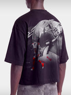 Black Next Chapter boxy tee on model, back view with No. 6 player and greyscale helmet graphic.