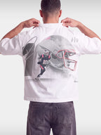 Monaco No. 10 Franchise tee in white worn by model, back view with oversized football helmet graphic.