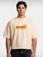 Ivory Trackside boxy tee worn by model, front view with small MONACO Monte-Carlo chest logo.