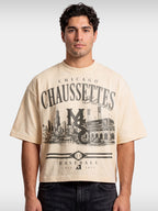 Monaco Chaussettes ivory boxy tee worn by model, front view with vintage-style baseball graphic.