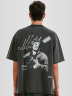 Man model wearing the Celebrini Legacy Blur Heavyweight Raw Hem Tee with motion blur hockey graphic — Monaco Social Club streetwear
