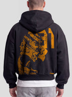 Model wearing the Racer No. 81 Heavyweight Full-Zip Hoodie in Faded Black with papaya-orange racing driver graphic — Monaco Social Club streetwear