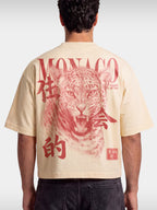 Monaco Primal Instinct ivory boxy tee worn by model, back view with red leopard graphic.
