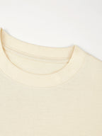 Ribbed crewneck collar detail on the ivory Monaco heavyweight cotton boxy tee.