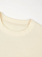 Ribbed crewneck collar detail on the ivory Monaco heavyweight cotton boxy tee.