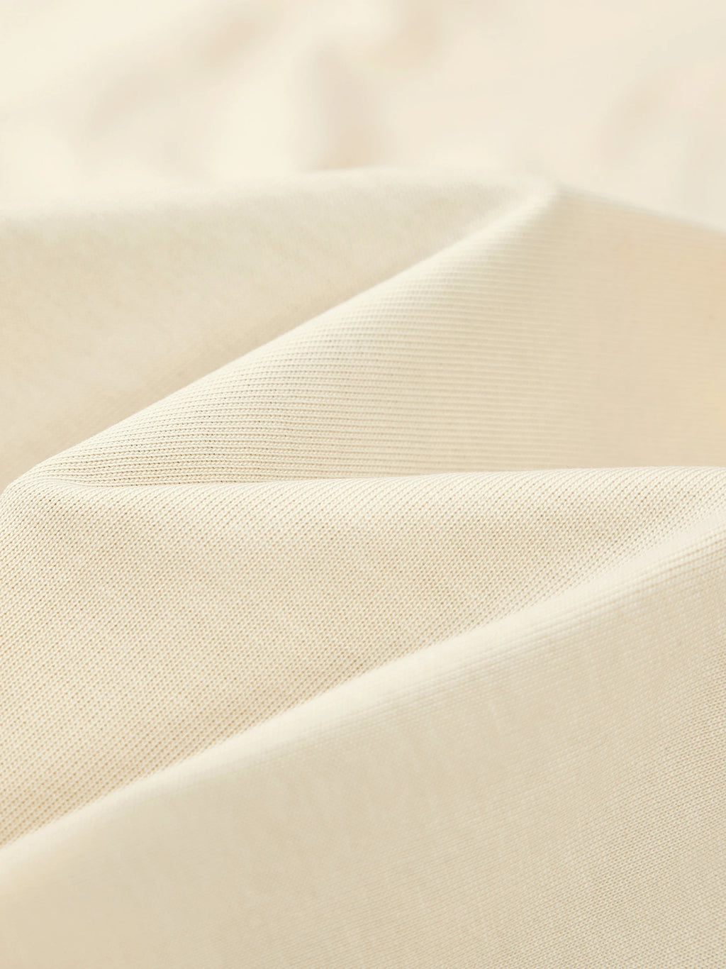 Heavyweight 100% cotton knit texture of the Monaco Boxy tee in ivory.