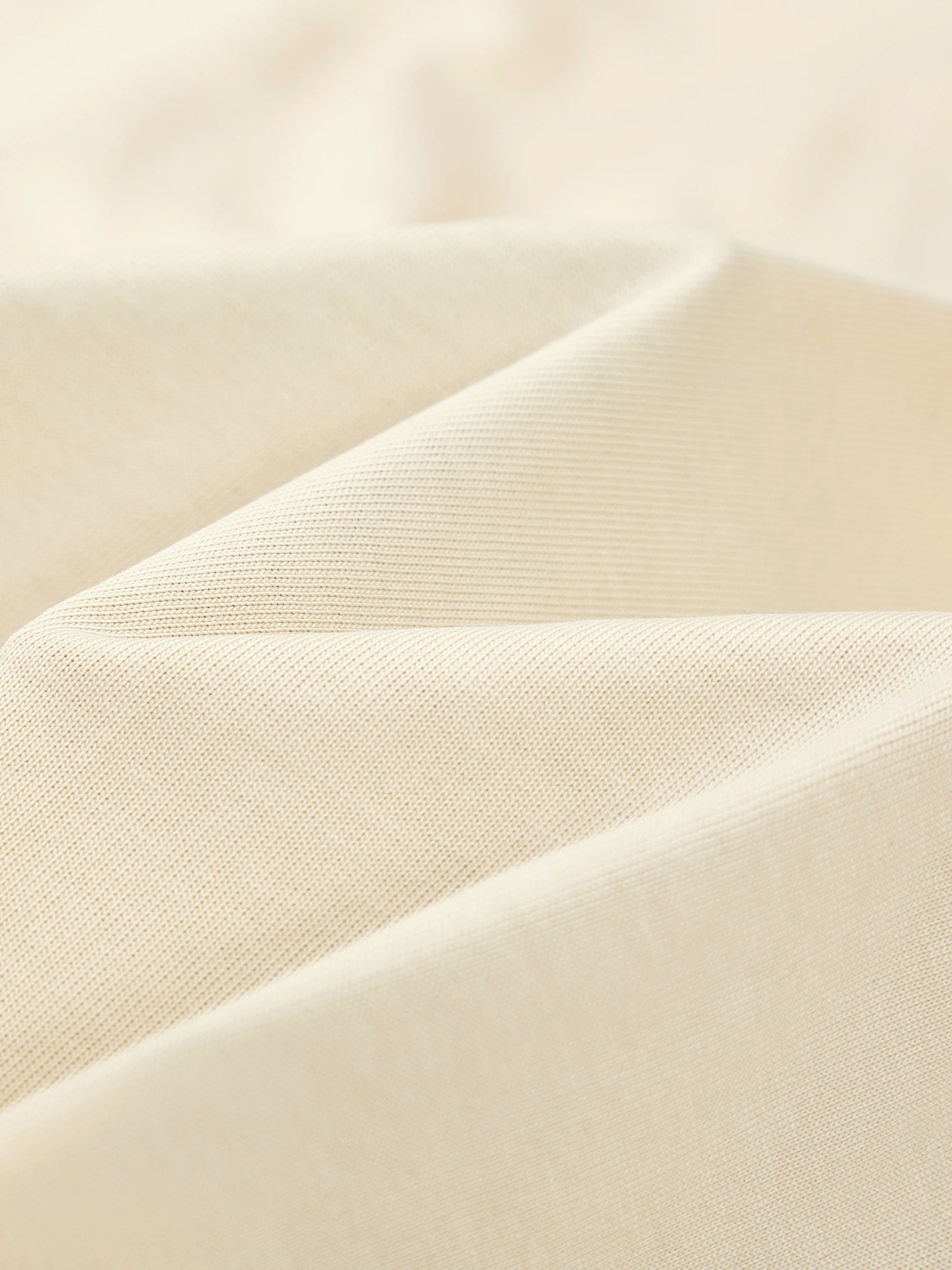 Heavyweight 100% cotton knit texture of the Monaco Boxy tee in ivory.