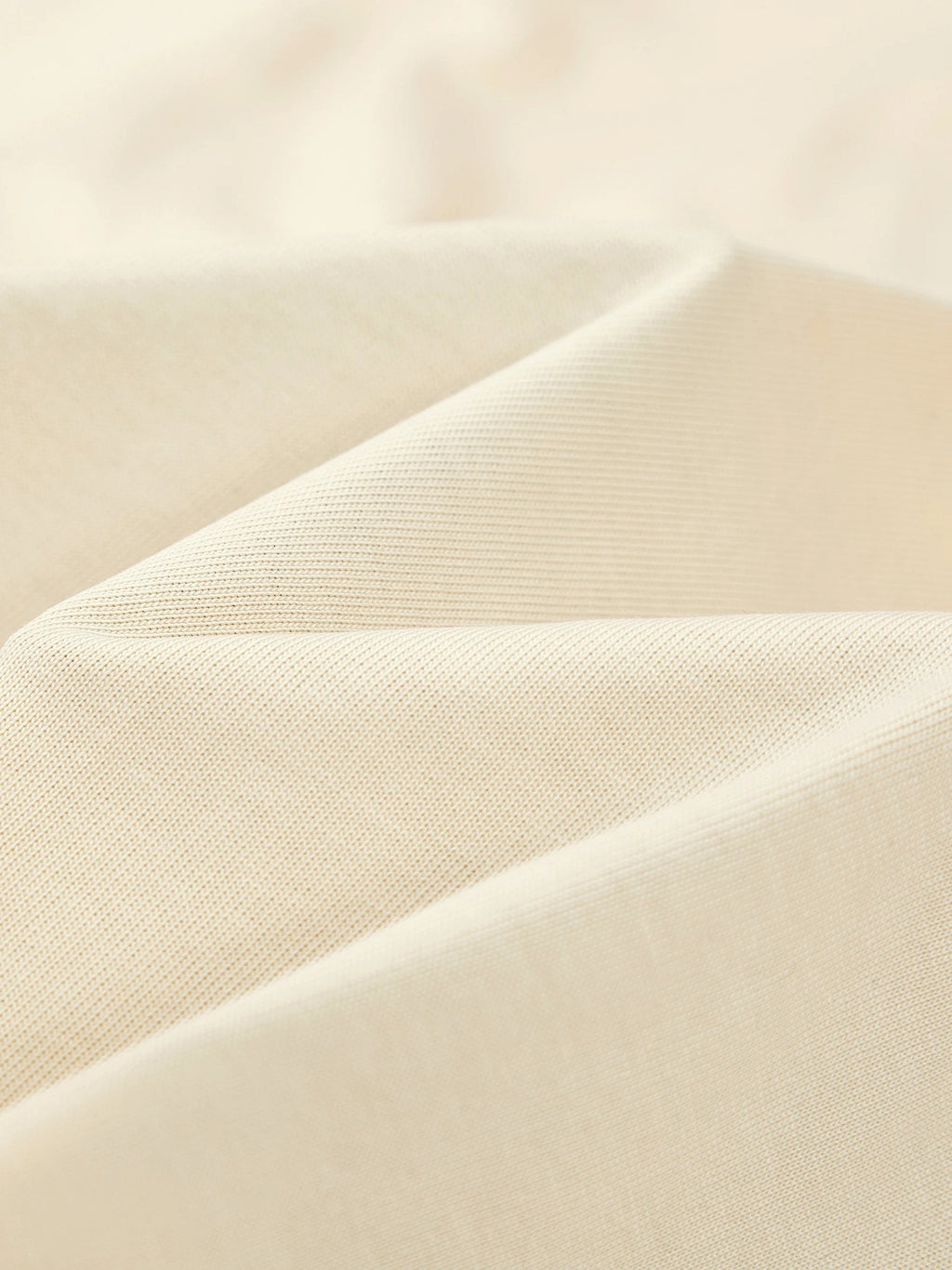 Heavyweight 100% cotton knit texture of the Monaco Boxy tee in ivory.