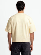 Monaco ivory boxy tee worn by model, back view showing heavyweight 280 GSM cotton and wide sleeves.