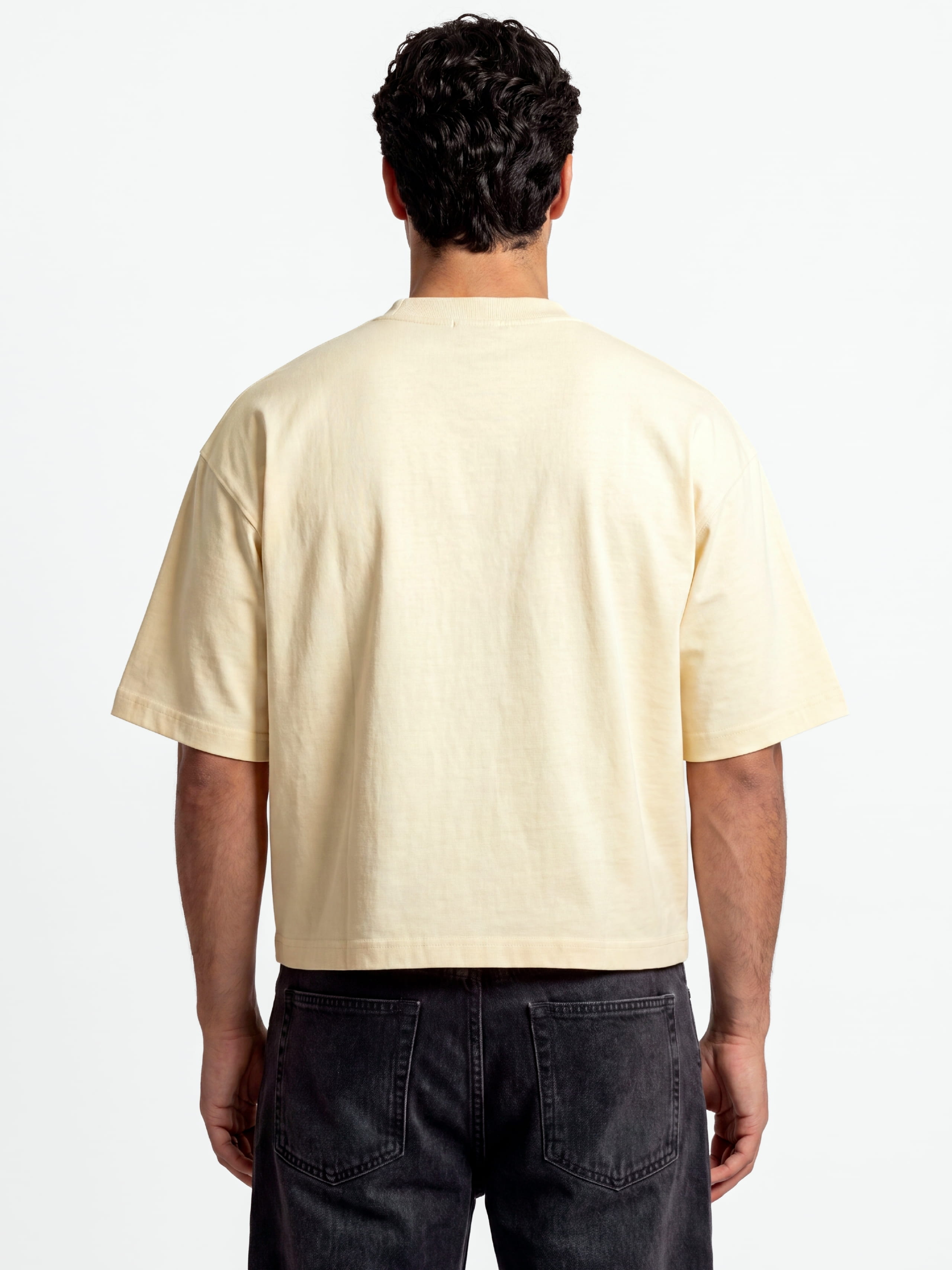Monaco ivory boxy tee worn by model, back view showing heavyweight 280 GSM cotton and wide sleeves.