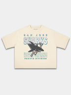 Monaco ivory Sharks vintage tee, front view with faded shark logo and teal block lettering.