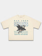 Monaco ivory Sharks vintage tee, front view with faded shark logo and teal block lettering.