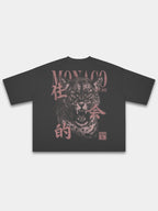 Monaco Primal Instinct black boxy tee, back view with roaring leopard graphic and MONACO lettering.