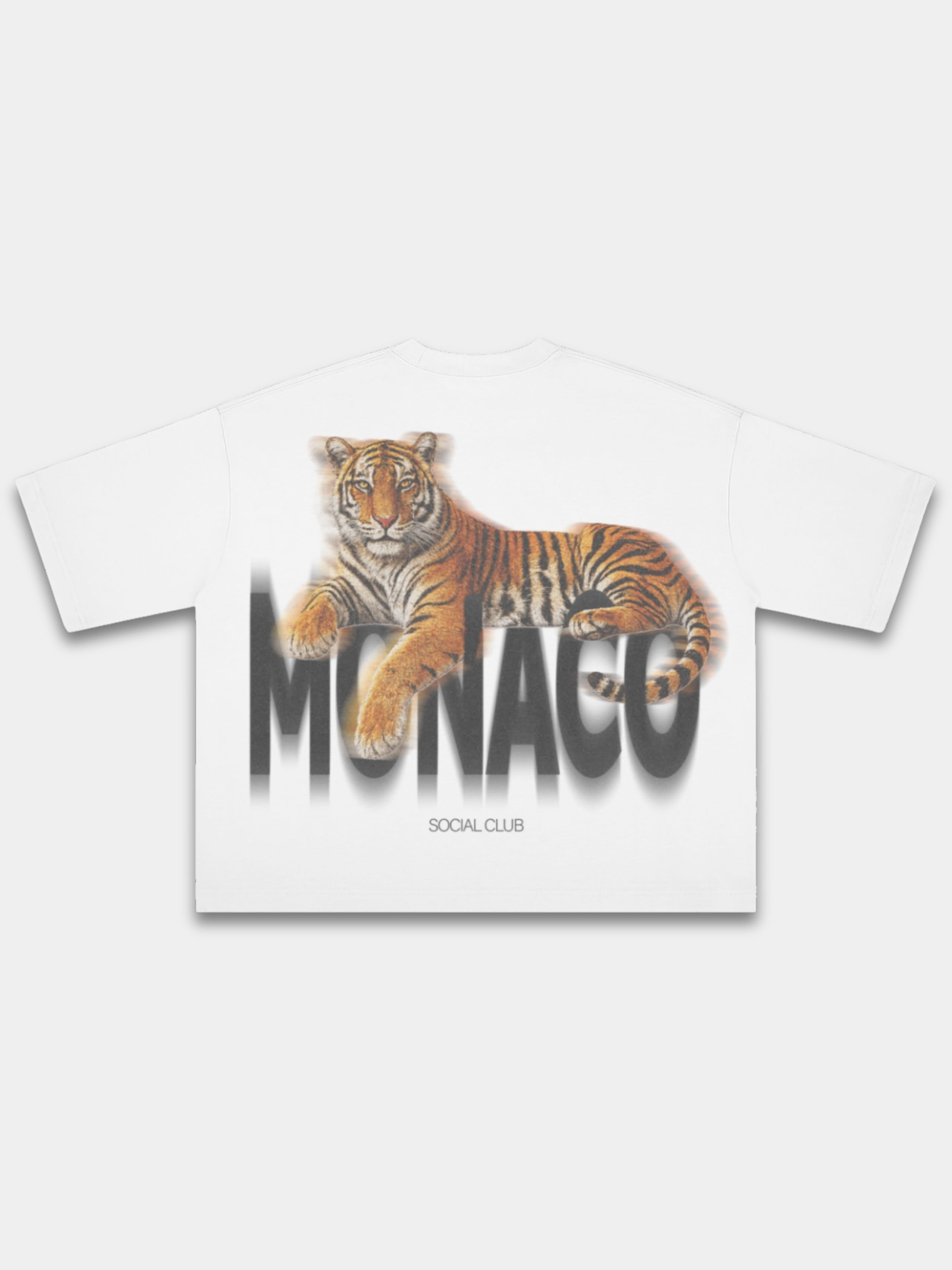 White Tiger boxy tee, back view with resting tiger above blurred black Monaco wordmark.