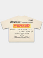 Ivory Trackside boxy tee, back view with layered motorsport text print and Monaco flag emblem.