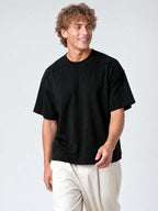 Black Monaco paneled shirt worn by model, front view with oversized fit and structured shoulder seams.