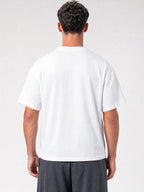 White Monaco paneled shirt worn by model, back view showing oversized cut and structured shoulders.